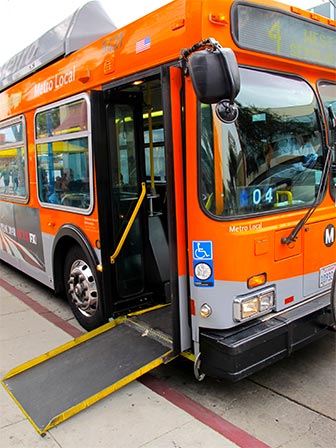 Los Angeles Metro buses have wheelchair accessible ramps and can lean over to assist passengers in boarding. [Photo Credit: LAtourist.com]