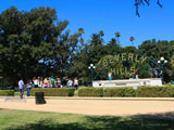 Tourists line up to take a picture near the iconic Beverly Hills Sign at Beverly Gardens park 