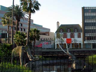 Foreground: Mammoths in LACMA's Lake Pit Walk. You can also see Craft and Folk Art Museum on the other side of Wilshire Blvd. [Photo Credit: LAtourist.com]