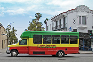 Rasta Bus (operated by A Day in L.A. tours) on Sunset Boulevard in Hollywood. [Photo Credit: LAtourist.com]