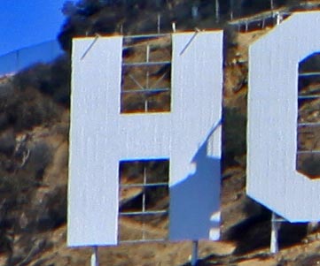 The letter H from the Hollywood Sign. The letters were originally 50 feet high, but now are slightly shorter at 45 feet. It is said to be haunted by the ghost of Peg Entwistle. Park rangers and hikers have reported seeing a young, blonde woman dressed in old-fashioned clothing who vanishes when approached. [Photo Credit: LAtourist.com]