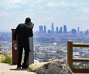 Tourist at Hollywood Overlook on Mulholland Drive. [Photo Credit: LAtourist.com]