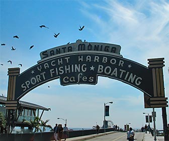 Sign at the entrance of the Santa Monica Pier. [Photo Credit: LAtourist.com]