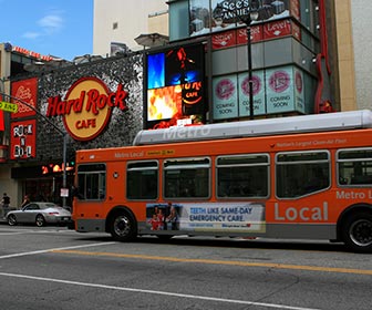 Metro Local Bus near the Hard Rock Cafe at Hollywood & Highland Center on Hollywood Boulevard. [Photo Credit: LAtourist.com]